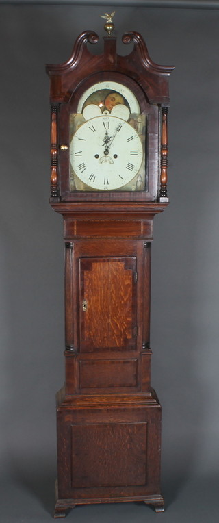 A late George III North Country oak longcase clock, the case  with broken swan neck pediment above a pair of ring turned  column supports, the crossbanded trunk door flanked by fluted  quarter pilasters above a box base, raised on ogee bracket feet.  Fitted a 12" painted broken arch Roman and Arabic dial with  moon phase, date aperture and second subsidiary dial, decorated  allegorical spandrels 88"h x 20"w x 10"d