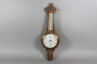 A Smith & Son, Croydon, a Victorian carved oak aneroid  barometer, fitted thermometer, 18.5"h x 6"w