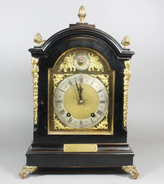Handford Ross, a late Victorian ebonised bracket clock in the mid 17th Century style, the arched top case ormolu mounted and  raised on scroll feet, having a Roman and Arabic silvered chapter  ring, set an 8 day dead beat movement signed W&H, SCH,  chiming gongs, 16"h x 10.5"w x 7"d  ILLUSTRATED