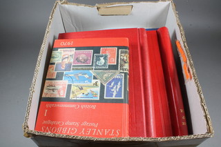 A box of GB and world stamps including 2 GB stamp albums in  poor condition