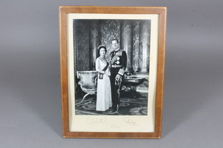 A signed black and white photograph of HM The Queen and  Prince Philip, signed and dated 1974, 9" x 6.5"
