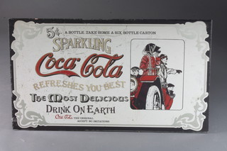 A Coca Cola advertising mirror 21"w x 36"h, some chips