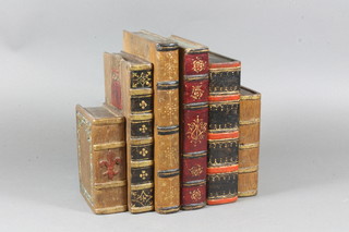 A pair of painted and carved wooden book ends in the form of  books