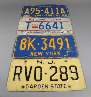 4 American pressed metal licence plates for N.J Garden, New  York, Washington and Pennsylvania