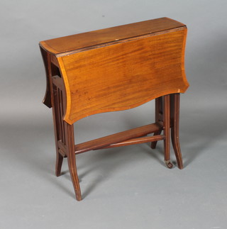 An Edwardian mahogany and satinwood crossbanded "butterfly" Sutherland table, raised on splayed legs 27"h x 24"d x 30"w