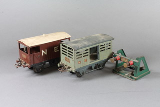 3 Hornby "O" gauge trucks comprising LMS gun powder van,  LNER live stock truck and break van, 1 boxed, together with  buffer stop and a quantity of track