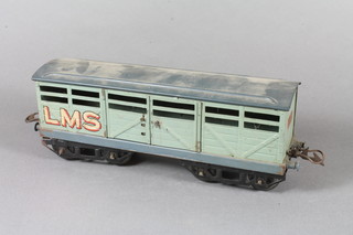 A Hornby "O" gauge cattle truck No.2, RS659, in pale green LMS livery, boxed 10.5"l