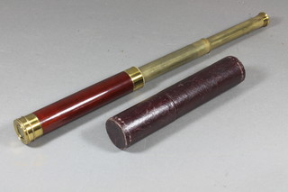 A 19th Century mahogany and brass 2 draw field telescope  contained in a leather case