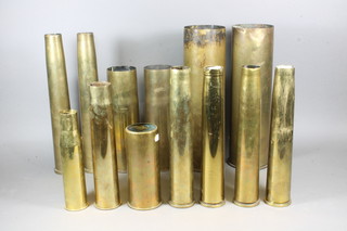 3 WWII 40mm anti aircraft shells marked 1944, 1 other, 2 brass 40mm shell cases with consecutive numbers 96503 and 96504, a  pair of WWII Continental 75mm shell cases dated 1941, a  105mm brass shell case, 1 other, brass Continental shell case 7",  2 anti aircraft shells 1 marked 1938 11" and a 37mm shell case