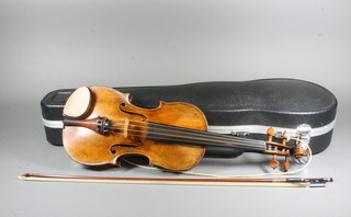 A 19th Century German violin 14.5", together with bow and  carrying case