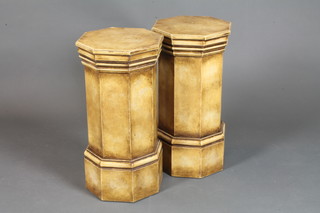 A pair of neo classical style octagonal pedestals of marble effect,  having moulded tops, raised on plinth bases, 24"h x 12"w