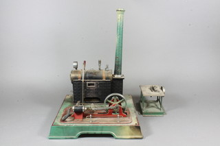 A Marklin stationery steam engine 17"w together with a belt driven saw bench 4.5"
