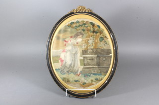 A 19th Century silk work picture of lady tending Shakespeare's  Tomb, 13.5" oval