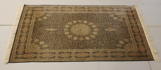 A fine silk Kashmir rug with central medallion 84" x 47.5"