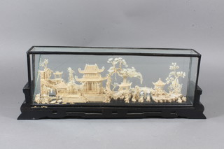 A 20th Century Japanese carved cork wood study of pagodas,  bridge and island 14.5"