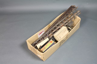 A collection of Hornby tin plate train accessories together with a quantity of track, various gauges