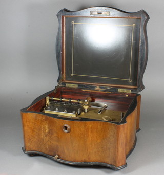 A late 19th Century walnut cased Polyphon, the hinged top enclosing a gilt metal mechanism and steel comb, 8"h x 15"w x 13"d together with a collection of German circular musical discs