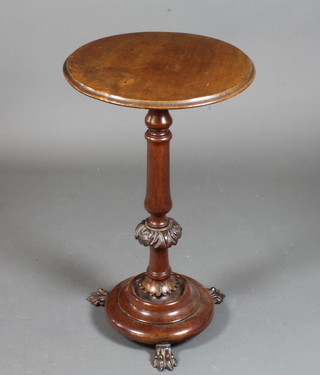 A late Victorian mahogany occasional table having a circular moulded top, raised on a foliate carved column support and  circular plinth base with claw feet 29"h x 18" diam.