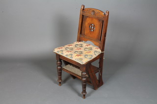 A late Victorian walnut metamorphic chair, having foliate carved cresting rail above a pierced splat and solid seat converting to  library steps, raised on turned legs