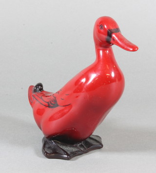 A Doulton flambe seated duck 6"