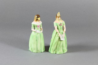 2 Royal Worcester candle snuffers in the form of standing ladies  with birds heads, both f and r, with purple Worcester mark to  base 4"