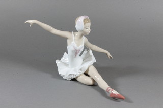 A Lladro figure of a seated ballerina 7"