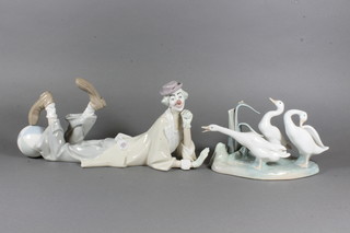 A Lladro reclining clown 14" and do. 3 geese - f and r