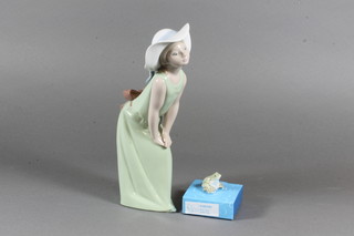 A Lladro standing girl with green dress and toad 8.5"