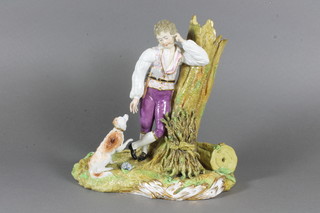 A Meissen figure of a standing woodsman with seated dog 9"