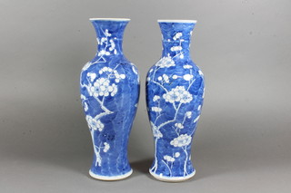 A pair of Chinese blue and white baluster shaped vases decorated prunus, the base with 4 character mark 12"