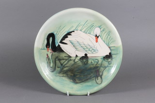 A circular Moorcroft charger decorated swans, the reverse  impressed Moorcroft 3500 and with candlestick mark 10"