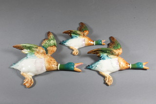 A flight of 3 Beswick ducks, the reverse impressed 596/2, 596/3 and 596/4 - 7" to 5.5"