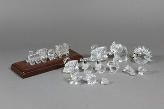 A Swarovski glass model train together with tender and carriage,  2 Swarovski glass figures of swans, do. elephant and 9 other   figures