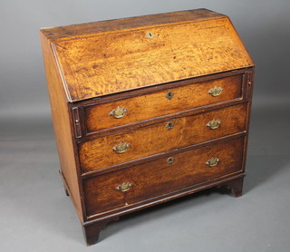 A George III oak bureau, the fall enclosing a fitted interior above  3 graduated long drawers on shaped bracket feet 40"h x 38"w x  21"d