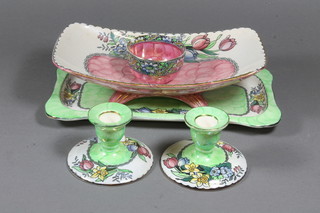 A pair of Malingware blue glazed and floral decorated stub candlesticks 6524, do. green glazed sandwich plate 6524 11" -  crazed, do. pink glazed dish 325 11" and a do. circular bowl  6330 3" - chip to rim