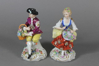 A pair of early 20th Century Naples porcelain figures of a seated lady and gentleman 5"