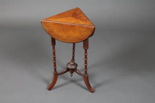 A Victorian walnut occasional table of trefoil form with shaped drop leaf top, raised on simulated bamboo supports, splayed feet,  25"h x 19"w