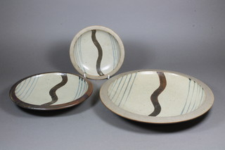Bernard Leach, St Ives Pottery, 1950's, a circular charger with wavy line decoration, the base with cypher mark 12" together  with 2 small ditto 9" and 6.5"