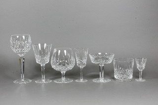 A suite of 42 Waterford Crystal Lismor pattern glasses  comprising 6 champagne saucers, 6 brandy balloons, 6 wine glasses, 6 hock glasses, 6 sherry glasses, 6 tumblers and 6  liqueur glasses