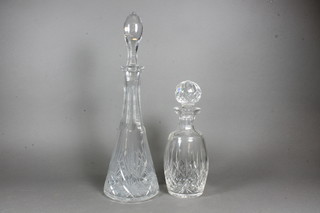 A cut glass waisted decanter and stopper 17" and a club shaped  ditto