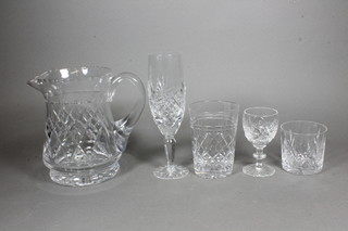 A Stuart cut glass jug 6" and a suite of 6 Tudor cut glass tumblers, 6 other tumbles, 6 champagne flutes and 4 liqueur  glasses