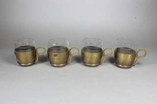 A set of 12 tea glasses with planished metal WMF bases