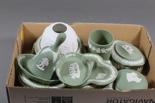 A collection of green Wedgwood Jasperware including plates,  bell, trinket boxes etc
