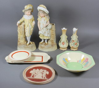 A pair of 19th Century biscuit porcelain figures of boy and girl 13", a circular terracotta plaque decorated cherubs 7", a Clarice  Cliff octagonal crocus pattern bowl 9", a 5 piece Clarice Cliff red  and gilt banded sandwich set comprising 12" plate and 4 tea  plates 6"