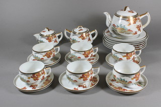 A 21 piece Japanese egg shell porcelain tea service with teapot, cream jug, twin handled sucrier, 6 plates, 6 cups and 6 saucers with lithophane panels