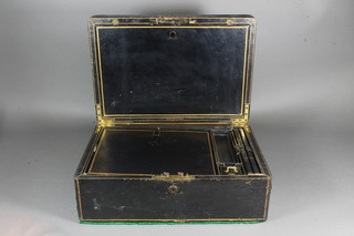 Asprey, 166 New Bond Street, London, a Victorian black leather and parcel gilt travelling writing box, the hinged lid enclosing a  fully fitted interior 6.5"h x 16"w x 10.5"d