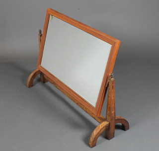 An early 19th Century Italian walnut toilet mirror, later rectangular bevelled plate, raised on fruitwood inlaid supports,  splayed feet 28"h x 38"w x 14"d