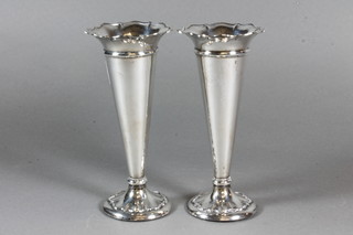 A pair of Edwardian silver trumpet shaped specimen vases raised on circular spreading feet, Birmingham 1909 6.5"