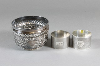 A Victorian embossed silver bowl, the base inset a coin, London 1894 and 2 silver napkin rings, 5 ozs