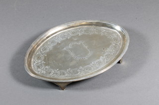 A George III oval engraved silver waiter/teapot stand raised on  panelled supports, London 1795 by Henry Chawner, 4 ozs